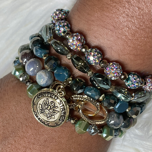  This stack was designed in honor of all of our Local Heroes!  This Army Stack displays a variety of green, taupe, and gold colored beads and is highlighted with a golden Army charm.